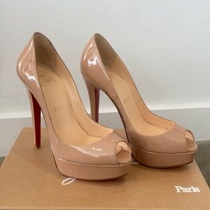 Christian louboutin nude patent leather heels.